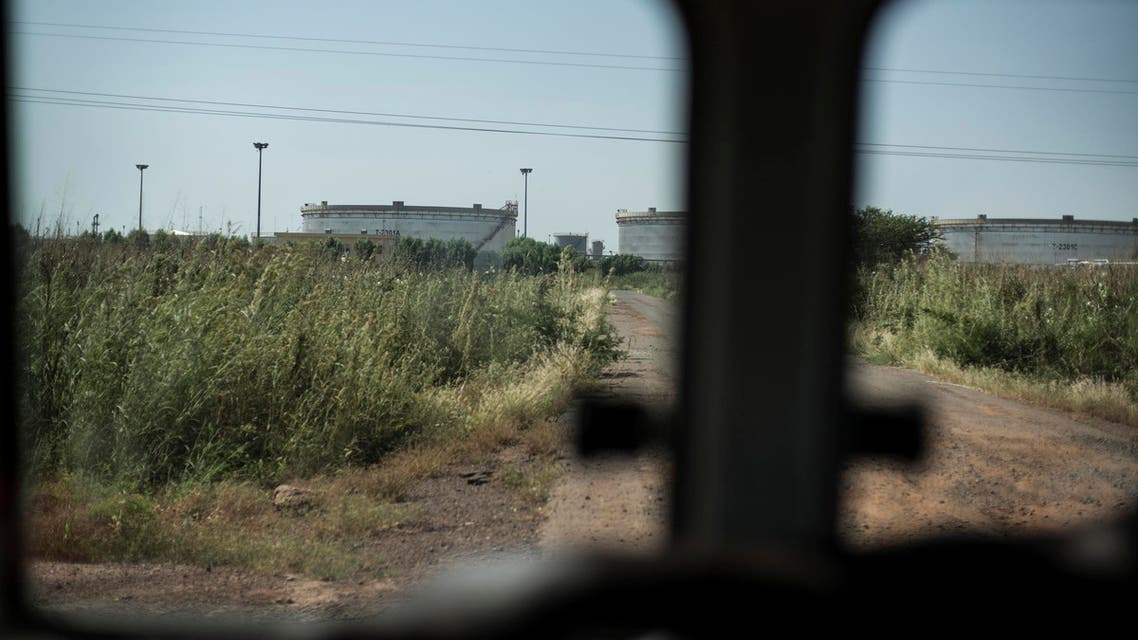 This photo taken from a vehicle Thursday, Oct. 30, 2014, shows silos in the oil fields of Paloch, South Sudan. AP