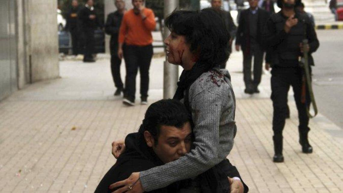 A photograph showing Shaimaa el-Sabbagh with blood running down her face as she is held up by a colleague became an iconic image that was widely shared on social media. (Reuters)