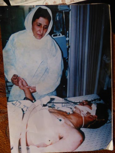 Fatma and her son Ahmed in 1994 after he was shot in the chest by Israeli soldiers with a dum-dum bullet that damaged his spinal cord.  (Al Arabiya/ Nabila Ramdani)