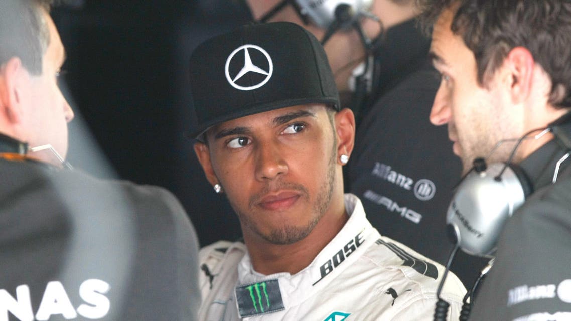 Mercedes driver Lewis Hamilton of Britain listens to technicians, during the second free practice at the Monaco racetrack, in Monaco, Thursday, May 21 2015. AP