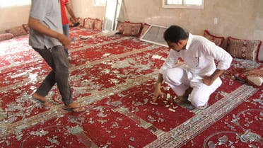 Police examine the debris after a suicide bomb attack at the Imam Ali mosque in the village of al-Qudaih. (Reuters)