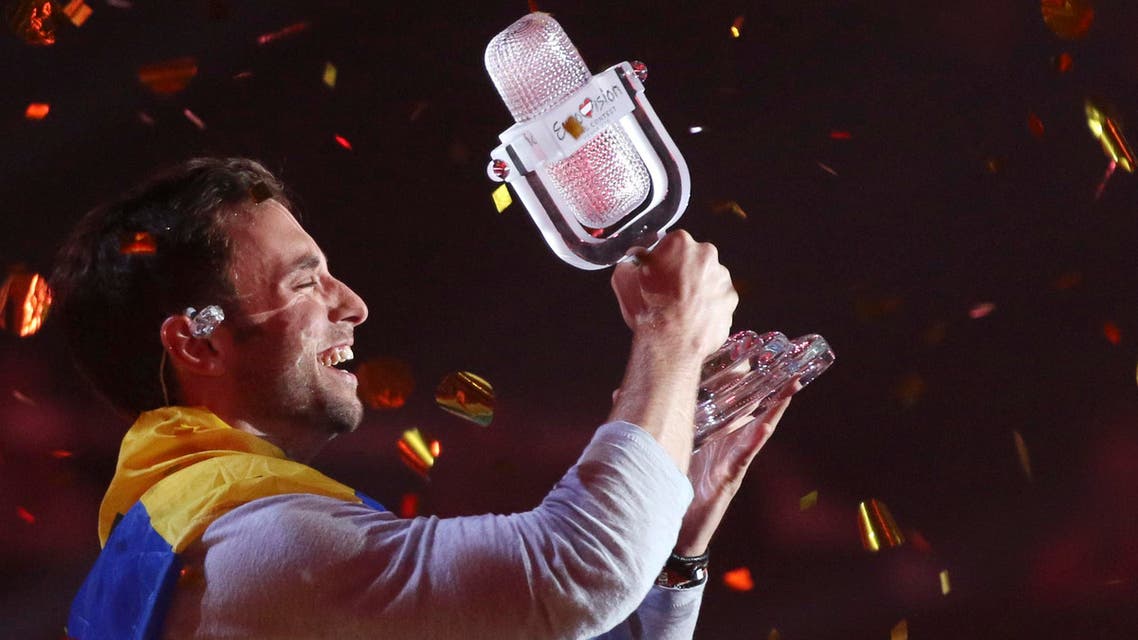 Mans Zelmerlow representing Sweden celebrates after winning the final of the Eurovision Song Contest in Austria's capital Vienna, Sunday, May 24, 2015. (AP Photo/Ronald Zak)