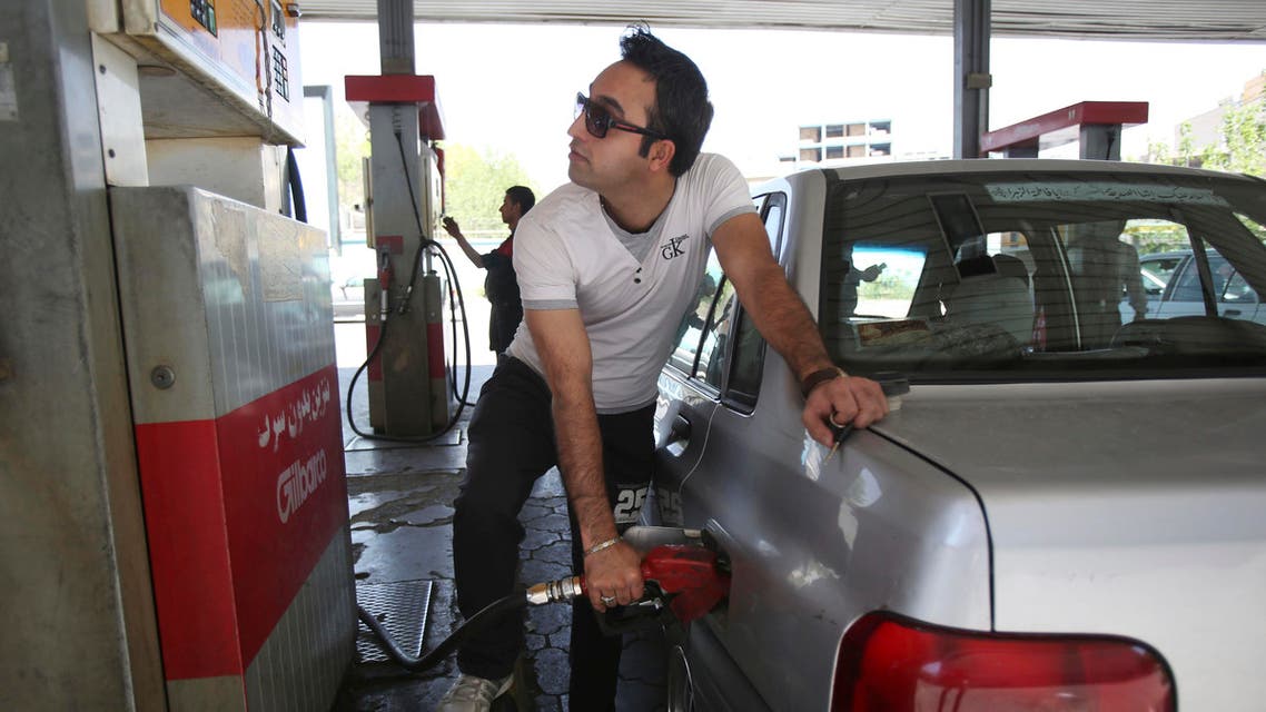 An Iranian man fills his car in a gas station in central Tehran, pictured on April 25, 2014. (AP)
