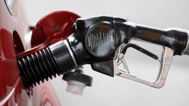 A gas pump nozzle is shown in Wednesday, Aug. 4, 2010, in Portland, Ore. Oil prices slipped toward $82 a barrel Thursday, pausing from a rally that lifted the commodity to a three-month high this week amid a weakening dollar and positive corporate earnings. (AP Photo/Rick Bowmer)