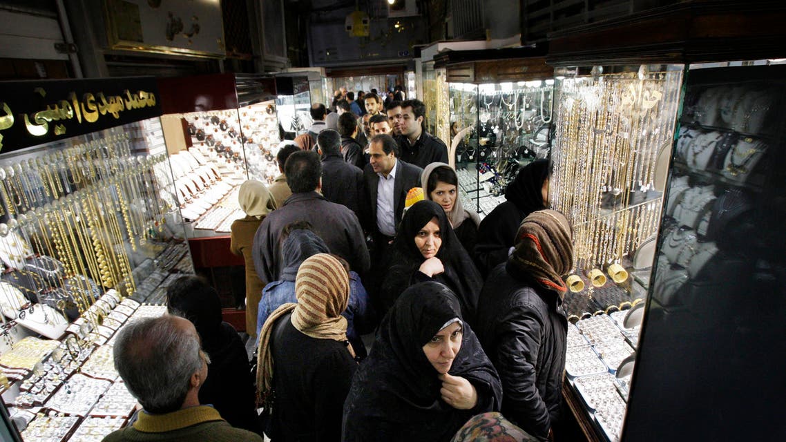 In this Thursday, Feb. 2, 2012 photo, Iranians walk at the gold market of Tehran's old main bazaar, Iran. A simple trip the store these days offers a crash course in life under sanctions. The price tags on many imported goods from South Korean refrigerators to Turkish crackers are sometimes double from last year. The money to buy them, meanwhile, has plunged in value against the U.S. dollar and other foreign currencies. (AP Photo/Vahid Salemi)