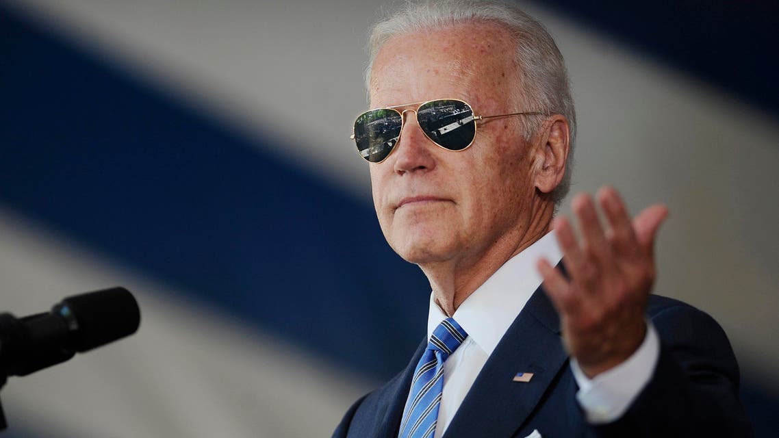 Vice President Joe Biden gestures after donning a pair of sunglasses as he delivers the Class Day Address at Yale University, Sunday, May 17, 2015, in New Haven, Conn. Biden urged graduating students to question the judgment of others, but not their motives to build consensus. (AP)
