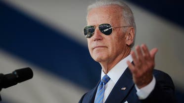 Vice President Joe Biden gestures after donning a pair of sunglasses as he delivers the Class Day Address at Yale University, Sunday, May 17, 2015, in New Haven, Conn. Biden urged graduating students to question the judgment of others, but not their motives to build consensus. (AP)