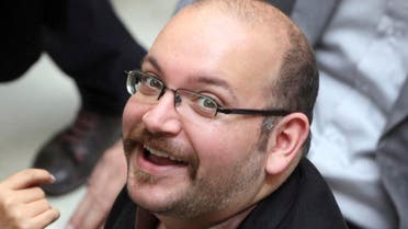 Jason Rezaian, an Iranian-American correspondent for the Washington Post, smiles as he attends a presidential campaign of President Hassan Rouhani in Tehran, Iran. (File Photo: AP)
