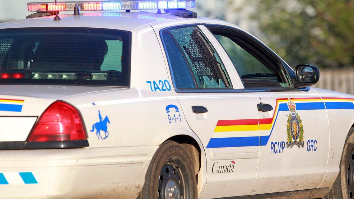 A Codiac Royal Canadian Mounted Police officer drives with the rear door window shattered by a bullet in Moncton, New Brunswick, on Wednesday, June 4, 2014. Three police officers were shot dead and two others injured Wednesday in the east coast Canadian province of New Brunswick, officials said, and authorities were searching for a suspect. The RCMP in New Brunswick confirmed on its Twitter feed that three officers were dead and two others had sustained non-life threatening injuries. (AP Photo/The Canadian Press, Viktor Pivovarov, Moncton Times & Transcript)