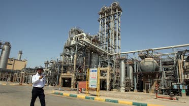 In this Sept. 28, 2011 file photo, an Iranian security guard stands at the Maroun Petrochemical plant at the Imam Khomeini port, southwestern Iran. (AP /Vahid Salemi)