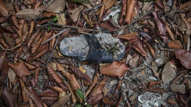 Clothes are photographed near abandoned human trafficking camp in the jungle close the Thailand border at Bukit Wang Burma in northern Malaysia May 26, 2015. (Reuters)