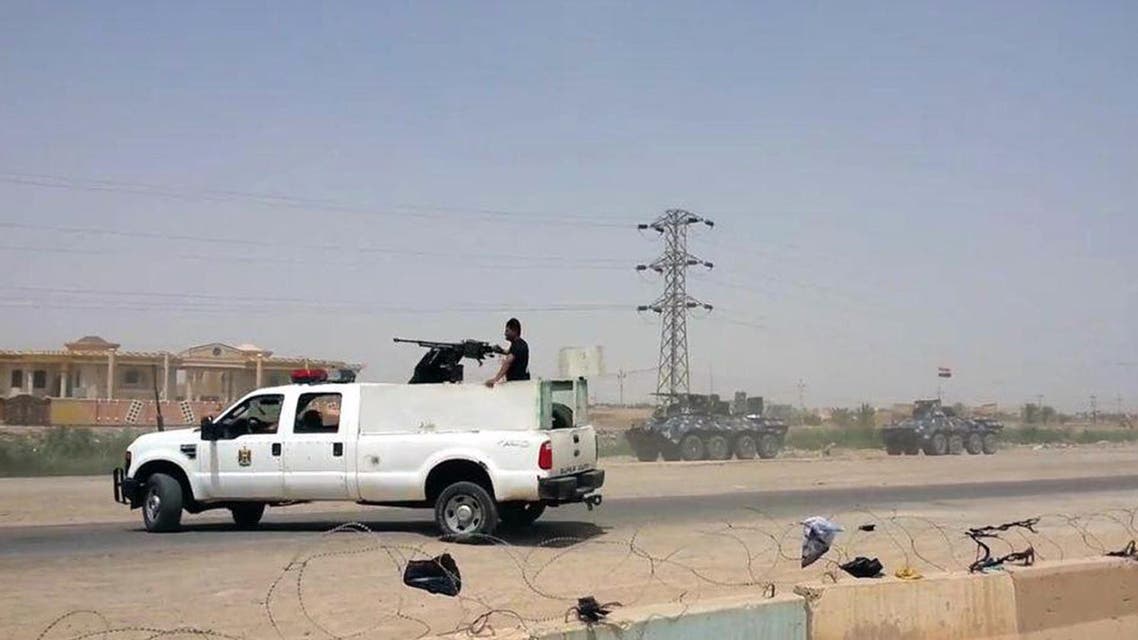 Arriving from Baghdad, federal police forces create a barricade to protect the Habaniyah military base near Ramadi, Iraq, in eastern Husaybah town, 8 kilometers (5 miles) east of Ramadi on Monday, May 18, 2015. Islamic State group militants likely killed up to 500 Iraqi civilians and soldiers and forced 8,000 people to flee from their homes as they captured Ramadi, a provincial official said Monday, while the extremists went door-to-door looking for policemen and pro-government tribesmen. (AP Photo)