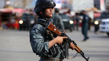 A member of the Afghan security forces stands guard at the site of a suicide car bombing attack in Kabul, Afghanistan, Tuesday, May 19, 2015. A large suicide car bombing struck downtown Kabul on Tuesday afternoon, apparently targeting justice ministry employees and killing several people, an Afghan official said. The attack happened in the car park of the Justice Ministry when a car packed with explosives was detonated, said Interior Ministry spokesman Sediq Sediqqi. (AP Photo/Rahmat Gul)