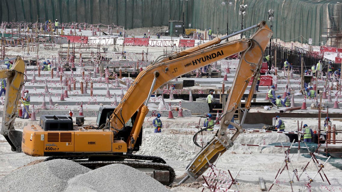 In this Monday, May 4, 2015 file photo taken during a government organized media tour, workers use heavy machinery at the Al-Wakra Stadium being built for the 2022 World Cup, in Doha, Qatar. (AP)