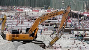 In this Monday, May 4, 2015 file photo taken during a government organized media tour, workers use heavy machinery at the Al-Wakra Stadium being built for the 2022 World Cup, in Doha, Qatar. (AP)