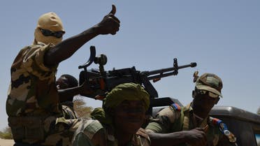 Nigerien soldiers patrol in Bosso, near the Nigerian border, on May 25, 2015. Niger has extended for three months the state of emergency in its southeastern Diffa region where the army has been battling Boko Haram militants since February, authorities announced on May 27, 2015. The operation, nicknamed Barkhane, which succedeed to Serval one, is taking place across Mauritania, Mali, Burkina Faso, Niger and Chad and involves a total 3,000 French troops. AFP PHOTO / ISSOUF SANOGO
