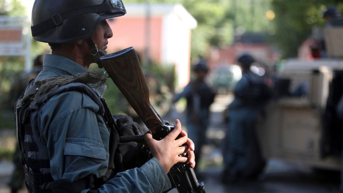 Afghan security officers Afghan stand guard near a guesthouse targeted in an attack by the Taliban, in Kabul, Afghanistan, Wednesday, May 27, 2015. (AP)