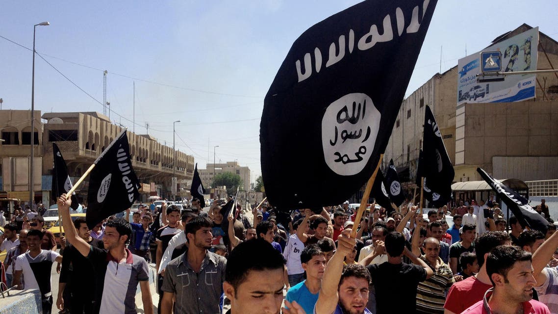 FILE - In this June 16, 2014 file photo, demonstrators chant pro-Islamic State group, slogans as they carry the group's flags in front of the provincial government headquarters in Mosul, 225 miles (360 kilometers) northwest of Baghdad. ISIS placed eighth on Google's list of 2014's fastest-rising global search requests, the company said Tuesday, Dec. 16, 2014. (AP Photo, File)