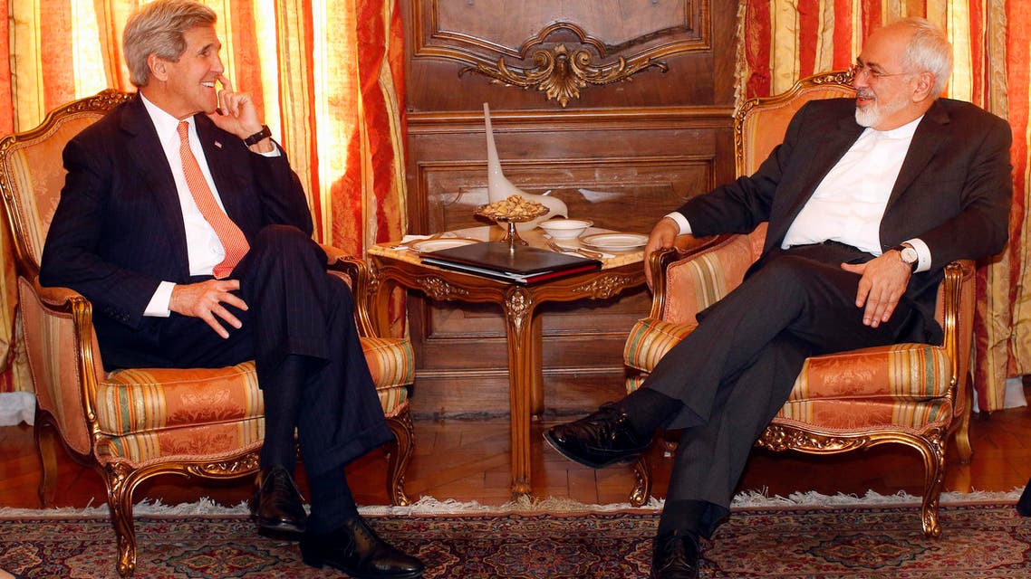 FILE In this April 27, 2015 file-pool photo, Secretary of State John Kerry meets with Iran's Foreign Minister Mohammad Javad Zarif in New York. A month out from a nuclear deal deadline, the top U.S. and Iranian diplomats are gathering in Geneva this weekend, hoping to bridge differences over how quickly to ease economic sanctions on Tehran and how significantly the Iranians must open up military facilities to international inspections. Kerry and Zarif will meet Saturday. (AP Photo/Jason DeCrow, File-Pool)
