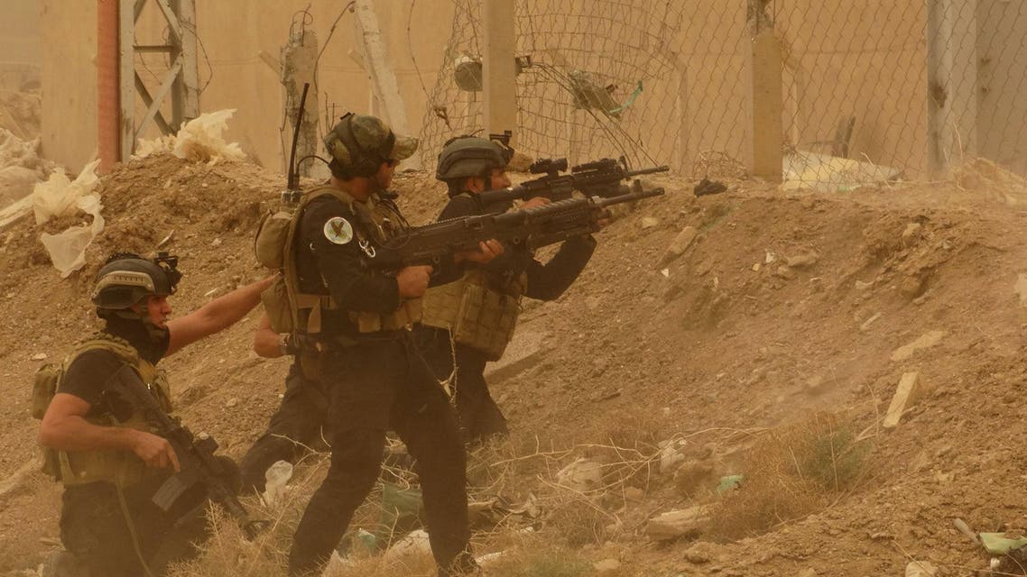 ecurity forces defend their headquarters against attacks by Islamic State extremists during sand storm in the eastern part of Ramadi, the capital of Anbar province AP