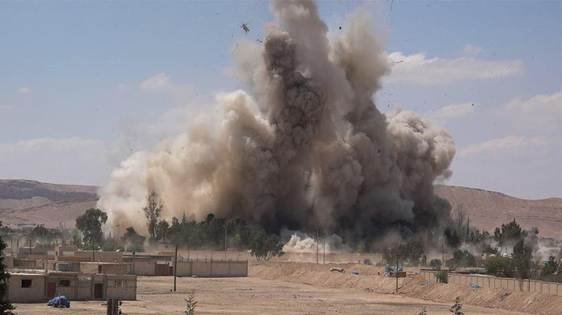 An image made available by militant media outlet Welayat Homs on May 30, 2015, allegedly shows the prison of the Syrian city of Palmyra being blown up by ISIS militants. (AFP)