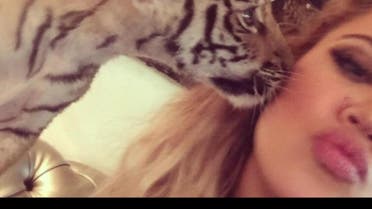 Khloe Kardashian's tiger cub selfie has raised a few eye brows citing the captivity of a wild animal. (Photo courtesy: Instagram)