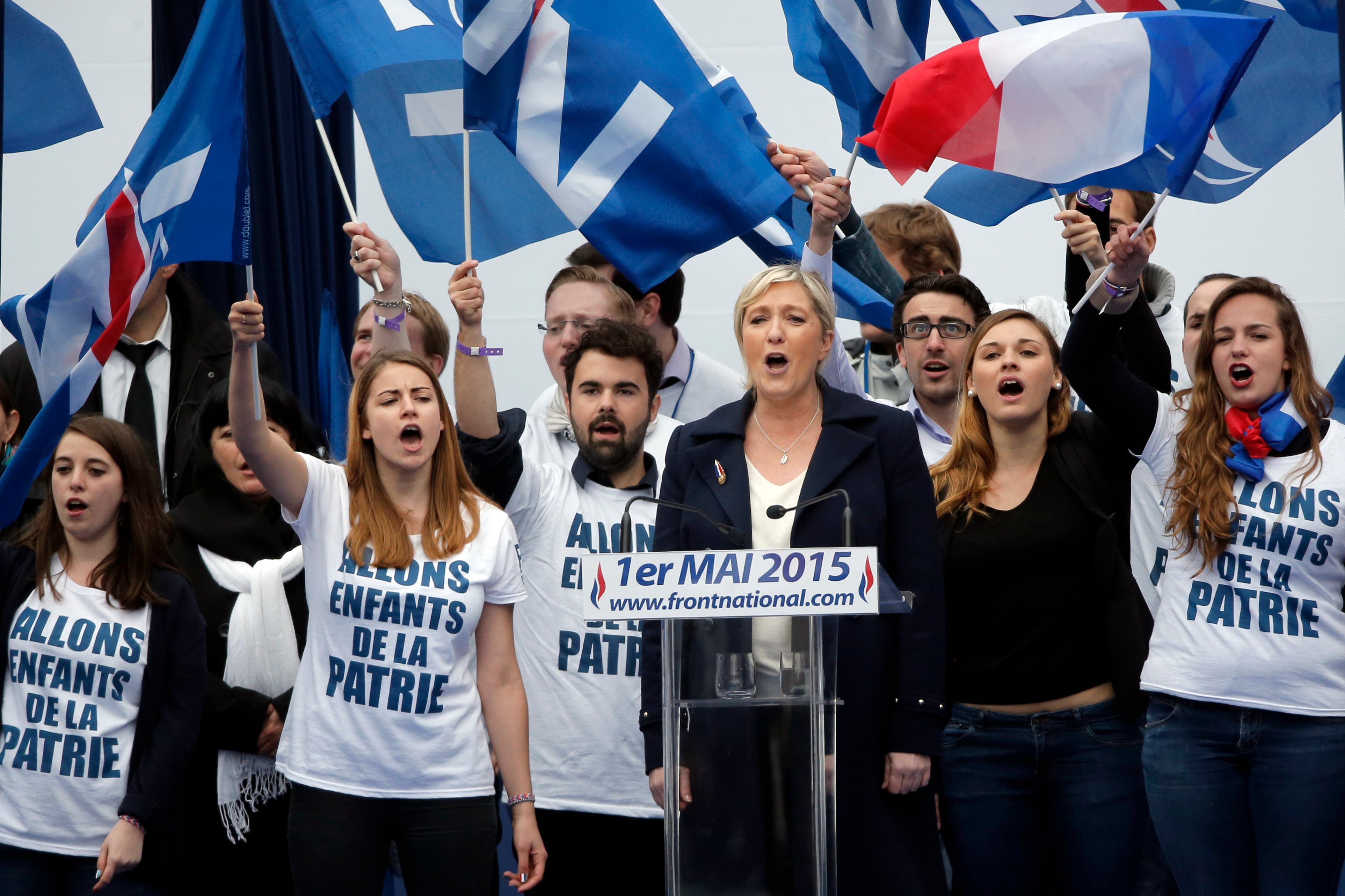 France’s far-right National Front president Marine Le Pen, center, surrounded by supporters. (File photo:AP