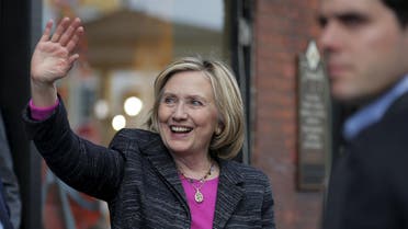 Democratic presidential candidate Hillary Clinton waves to supporters gathered outside after she spoke at the Water Street Bookstore in Exeter, New Hampshire May 22, 2015. REUTERS/Brian Snyder