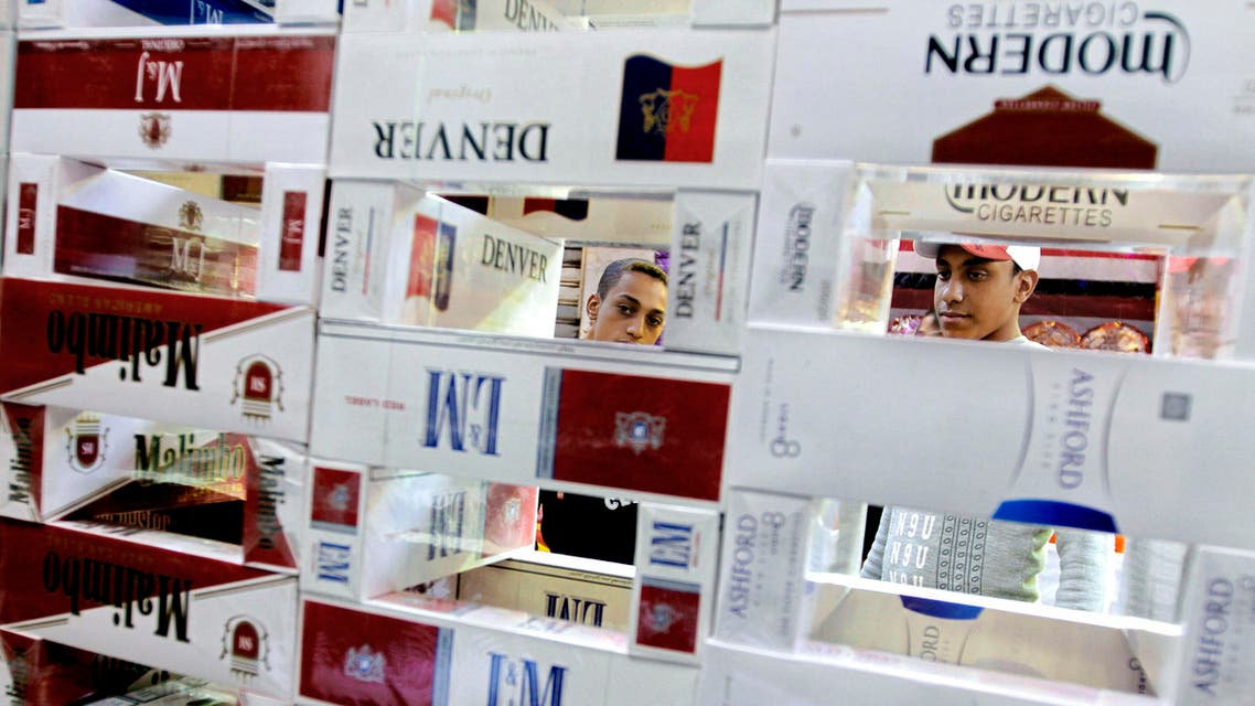 Egyptians buy imported cigarettes at a popular market in Cairo, Egypt.