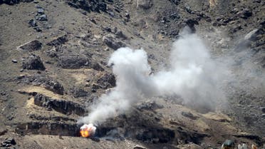Smoke billows from Noqum mountain after it was hit by an air strike in Yemen's capital Sanaa. (Reuters)