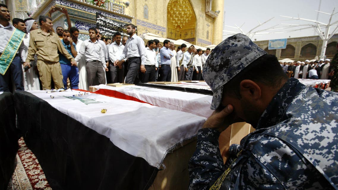 Iraqi mourners attend the funeral of members of the security forces who were killed the previous day in a suicide attack on an Iraqi police base north of Baghdad that killed at least 37 people, on June 2, 2015 in the holy Shiite city of Najaf in southern Iraq. AFP