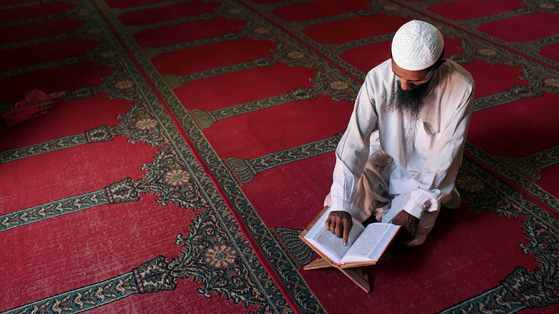 A Bangladeshi Muslim reads the holy Quran at a mosque during Ramadan in Dhaka, Bangladesh, Thursday, July 17, 2014. Muslims throughout the world are marking the month of Ramadan, during which they fast from dawn till dusk. (AP Photo/A.M. Ahad)