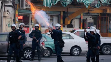 Riot police fire tear gas canisters toward Bahraini anti-government protesters during clashes in Daih, Bahrain, on Friday, March 13, 2015. Protesters marched in opposition areas nationwide to mark four years since Saudi and Emirati forces arrived to help the Bahraini government crush a pro-democracy uprising. Demonstrators in Daih demanded freedom for jailed relatives and political leaders before the march devolved into clashes between riot police firing tear gas and shotgun pellets and youths throwing petrol bombs, steel bars and stones. (AP Photo/Hasan Jamali)