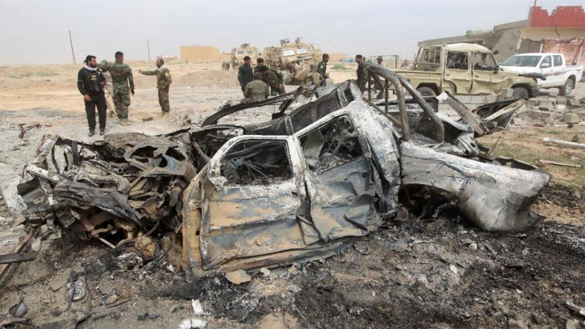 Iraqi Shiite fighters stand at the site of a car bomb on March 12, 2015 in a suburb of Tikrit during a military operation to retake the city from ISIS. (File Photo: AFP)