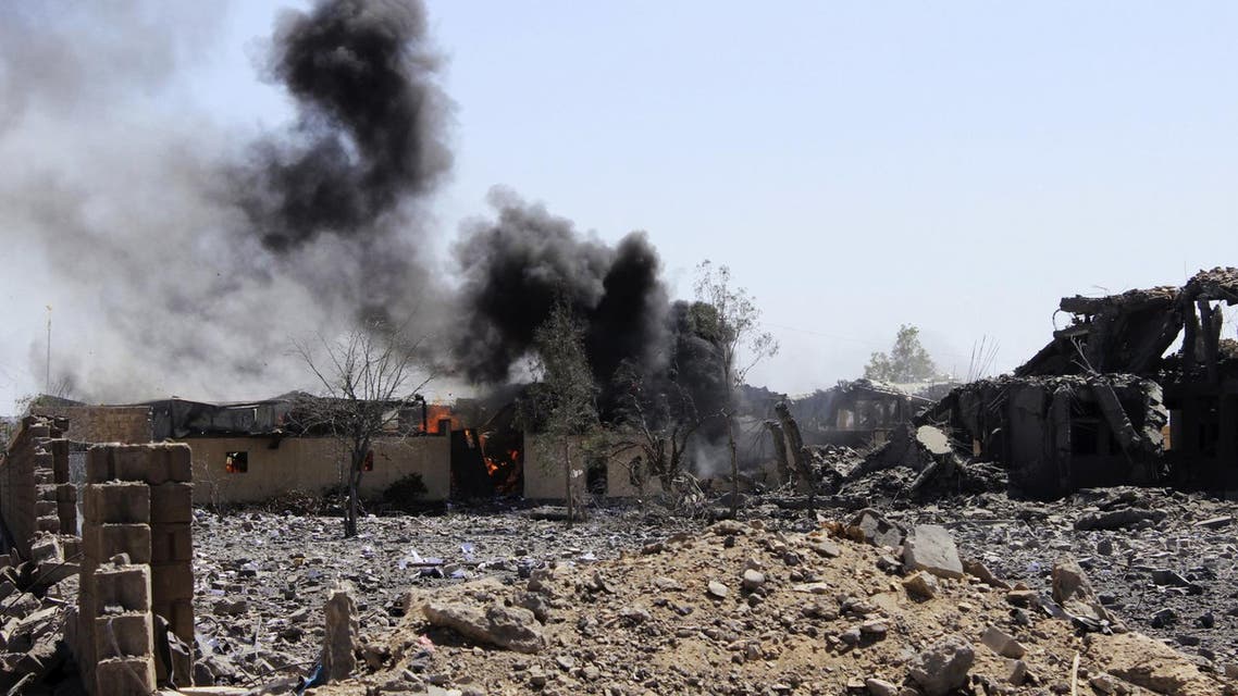 Smoke billows from a storage building belonging to the education ministry's printing press corporation after it was hit by a Saudi-led air strike in Yemen's northwestern city of Saada. (Reuters)