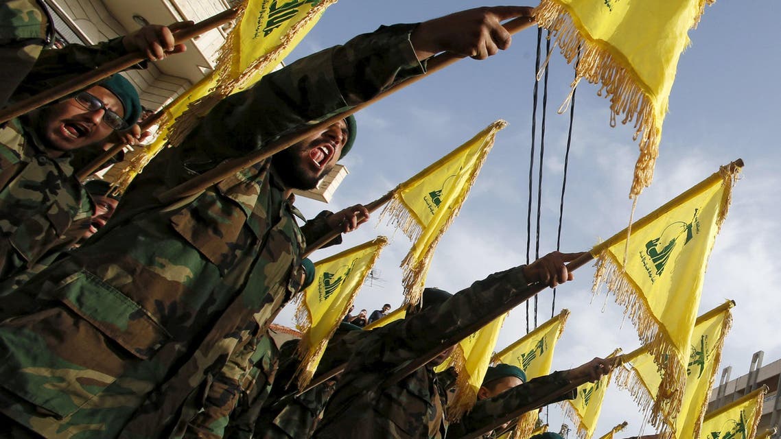 Lebanon's Hezbollah members carry Hezbollah flags during the funeral of their fellow fighter Adnan Siblini, who was killed while fighting against insurgents in the Qalamoun region, in al-Ghaziyeh village, southern Lebanon May 26, 2015. Hezbollah is fighting across all of Syria alongside the army of Syria's President Bashar al-Assad and is willing to increase its presence there when needed, the leader of the Lebanese Shi'ite movement said on Sunday. REUTERS/Ali Hashisho