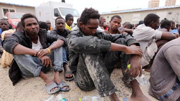  Migrants from sub-Saharan Africa rest inside a detention center in the Libyan capital Tripoli on June 4, 2015. AP