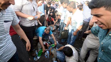 njured people get first aid after an explosion during an election rally of pro-Kurdish Peoples' Democratic Party (HDP) in Diyarbakir, Turkey, June 5, 2015. (Reuters)