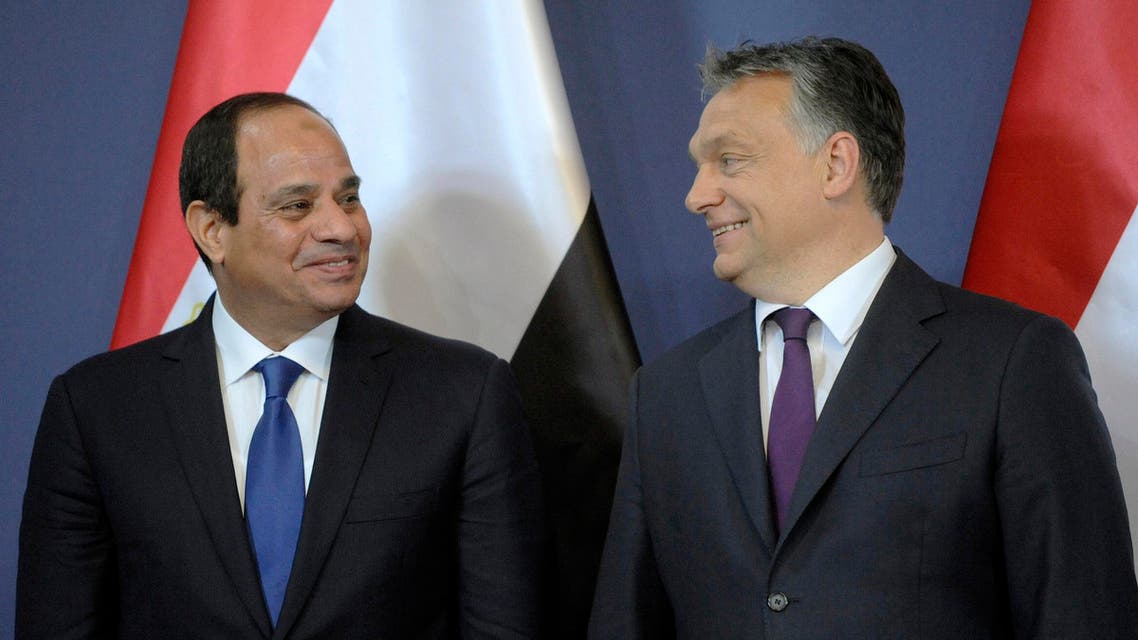 Egyptian President Abdel Fattah el-Sissi, left, and Hungarian Prime Minister Viktor Orban share a smile during a signing ceremony in the Parliament building in Budapest, Hungary, Friday, June 5, 2015. AP