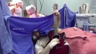 Guitar player strums Beatles hit during brain surgery