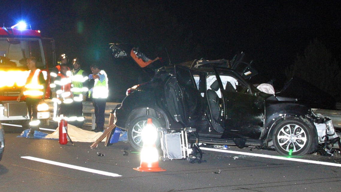 Emergency services attend the scene of a crash involving a car belonging to All Blacks rugby player Jerry Collins on the highway near Beziers, southern France, Friday, June 5, 2015. (AP)