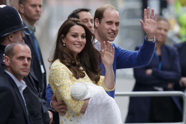 A Saturday, May 2, 2015 photo from files showing Britain's Prince William and Kate, Duchess of Cambridge with their newborn baby, Princess Charlotte Elizabeth Diana, waving to the public as they leave St. Mary's Hospital's exclusive Lindo Wing in London. (File Photo; AP)