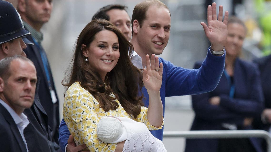 A Saturday, May 2, 2015 photo from files showing Britain's Prince William and Kate, Duchess of Cambridge with their newborn baby, Princess Charlotte Elizabeth Diana, waving to the public as they leave St. Mary's Hospital's exclusive Lindo Wing in London. (File Photo; AP)