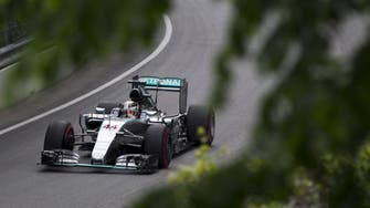 Motor racing-Hamilton crashes but still quickest in Canada