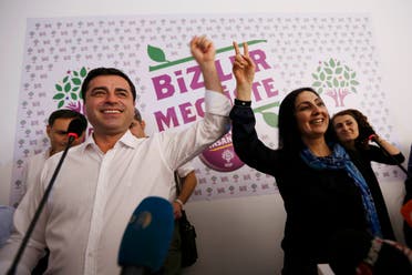 Co-chairs of the pro-Kurdish Peoples' Democratic Party (HDP), Selahattin Demirtas (L) and Figen Yuksekdag celebrate inside party's headquarters in Istanbul, Turkey, June 7, 2015. (Reuters)