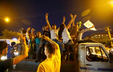 Supporters of the pro-Kurdish Peoples' Democratic Party (HDP) ride on a truck as they celebrate along a street after the parliamentary election in Diyarbakir, Turkey, June 7, 2015. (Reuters)