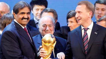 FIFA President Joseph Blatter is flanked by Russian Deputy Prime Minister Igor Shuvalov, right, and Sheikh Hamad bin Khalifa Al-Thani, Emir of Qatar, after the announcement that Russia will be the host country for the soccer World Cup 2018 and Qatar the host for the tournament in 2022 in Zurich, Switzerland, Thursday, Dec.2, 2010. (File Photo: AP)