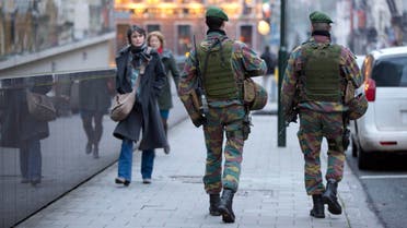 Two Belgian soldiers patrol the street outside of EU headquarters during a meeting of EU foreign ministers in Brussels on Monday, Jan. 19, 2015. The European Union is calling for an anti-terror alliance with Arab countries to boost cooperation and information sharing in the wake of deadly attacks and arrests across Europe linked to foreign fighters. (AP Photo/Virginia Mayo)
