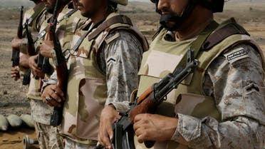 Saudi soldiers with their weapons stand guard at the Yemen border in Jizan, Saudi Arabia. (File: AP)