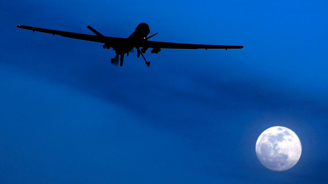 FILE - In this Jan. 31, 2010 file photo, an unmanned U.S. Predator drone flies over Kandahar Air Field, southern Afghanistan, on a moon-lit night. A U.N. expert on Friday, Oct. 18, 2013 called on the United States to reveal the number of civilians it believes have been killed by American drone strikes targeting Islamic militants. U.N. Special Rapporteur Ben Emmerson said that preliminary information gathered for a new report indicated more than 450 civilians may have been killed by drone strikes in Pakistan, Afghanistan and Yemen, but more work needs to be done to confirm the figures.(AP Photo/Kirsty Wigglesworth, File)